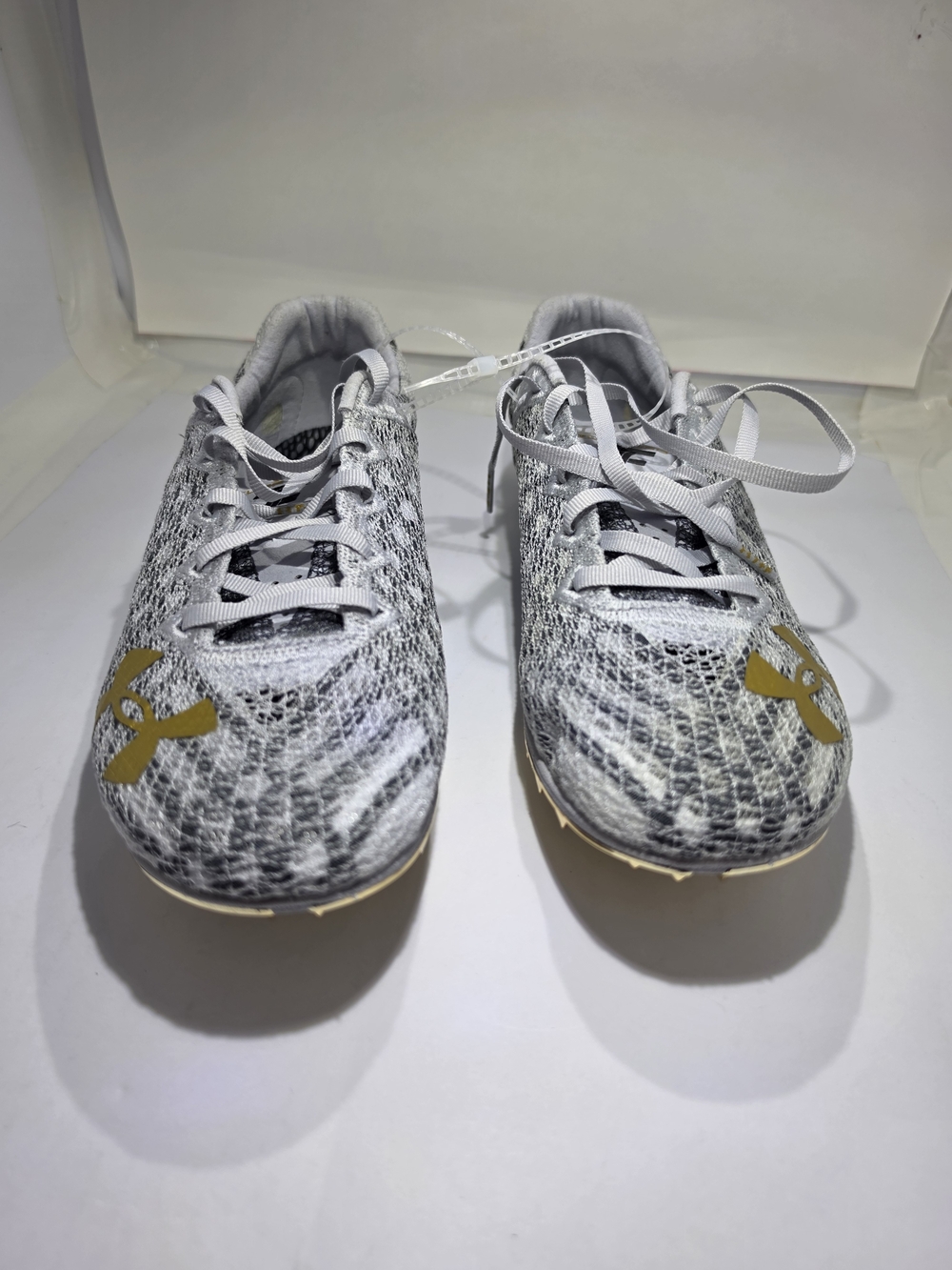 Under Armour Grey & White Athletic Cleats with Gold Logo